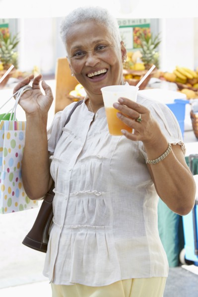 African American woman drinking juice