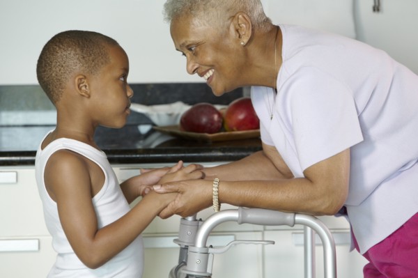 African American grandmother holding hands with grandson