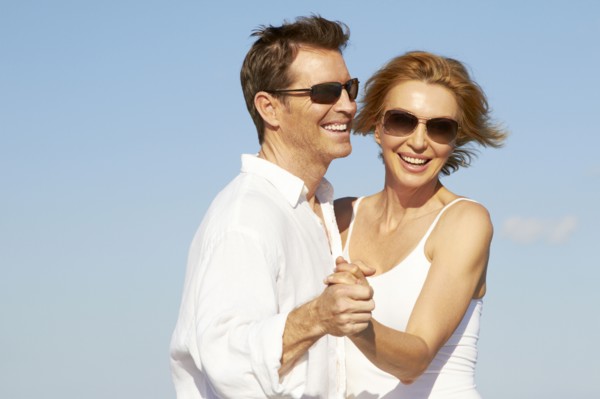 Caucasian couple dancing outdoors