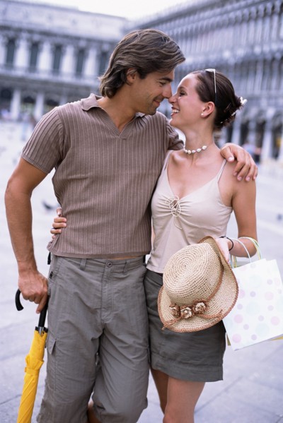 Caucasian couple hugging in St. Mark's Square