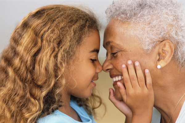 Senior woman and granddaughter touching noses