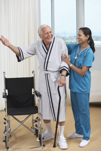 Nurse helping Senior patient use cane