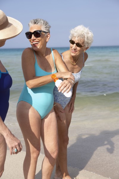 Senior women walking on beach
