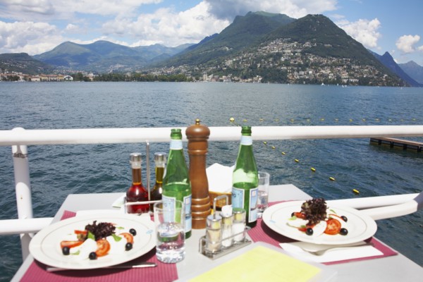 Plates of food at restaurant overlooking rural lake
