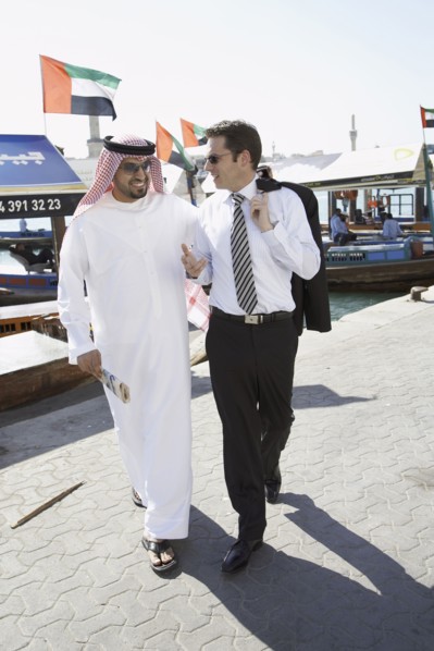 Businessmen talking on city street