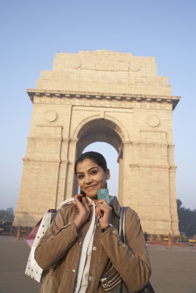 Indian woman smiling by India Gate