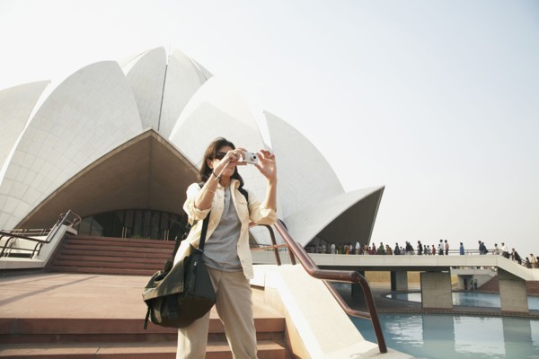 Caucasian tourist taking pictures at Bahai Temple