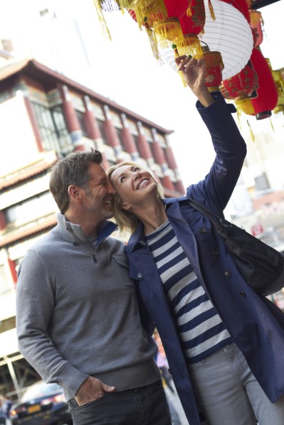 Caucasian couple shopping in Chinatown