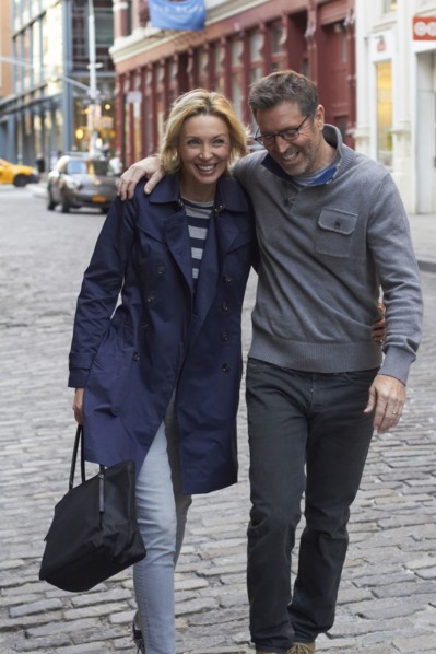Caucasian couple walking on city street