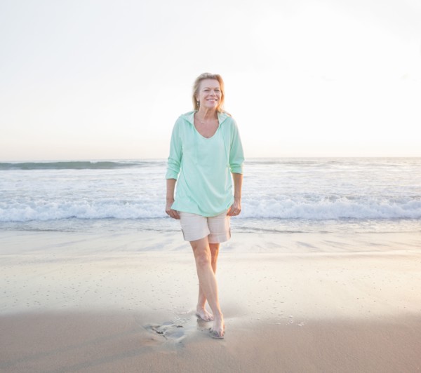 Caucasian woman smiling on beach