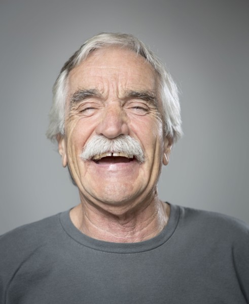 Close up of older Caucasian man laughing