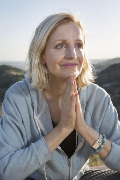 Close up of Caucasian woman with hands clasped
