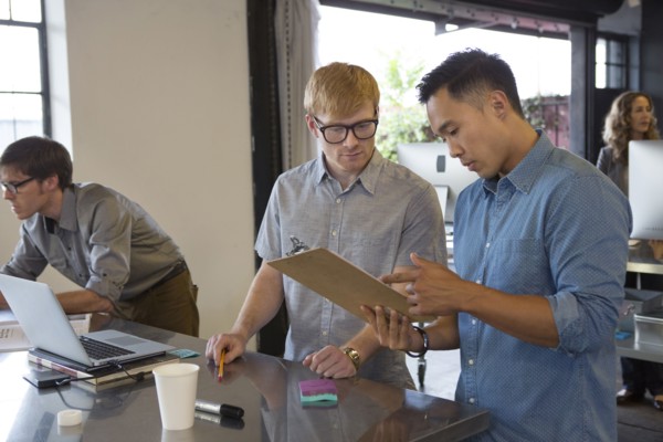 Businessmen talking in office