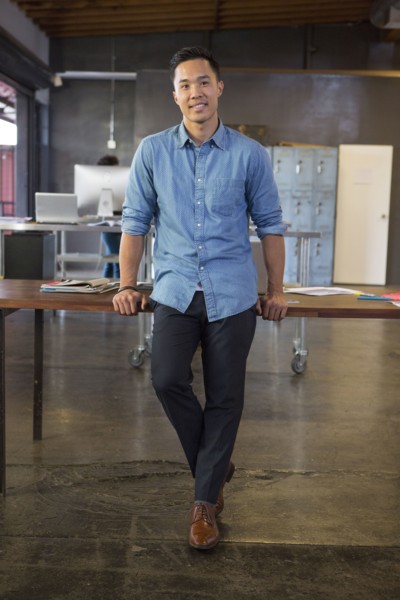 Mixed race businessman smiling in office