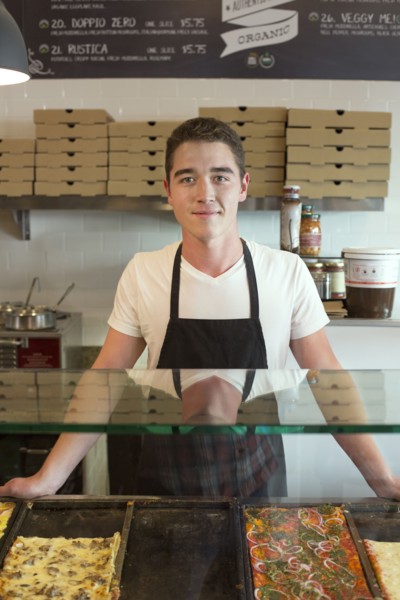 Server smiling in cafe