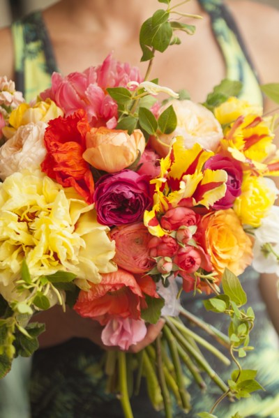 Close up of woman holding bouquet of flowers