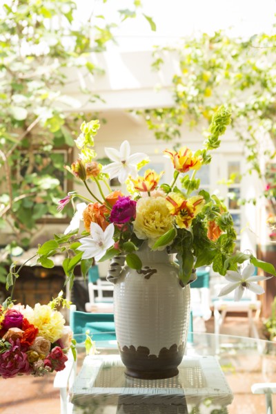 Bouquet of flowers in vase on backyard patio