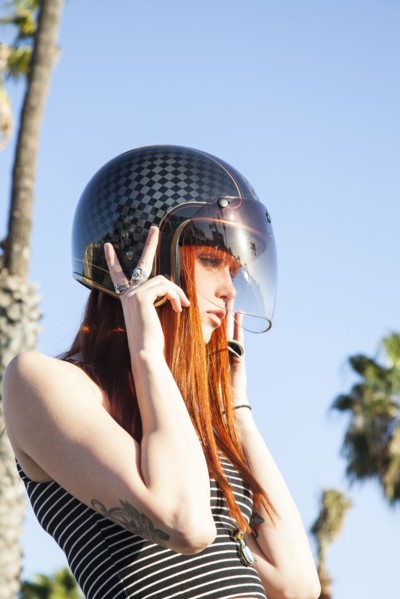Caucasian woman wearing motorcycle helmet