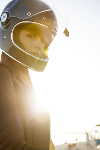 Caucasian woman wearing motorcycle helmet