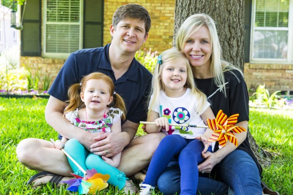 Caucasian family smiling in backyard