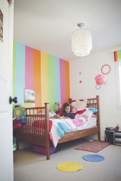 Caucasian girl using digital tablet in bedroom