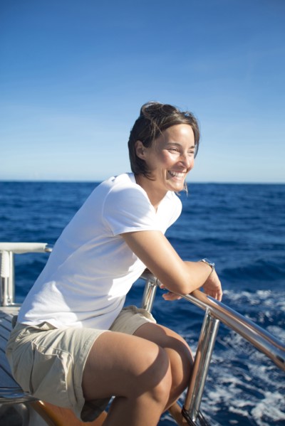 Caucasian woman sitting on boat deck