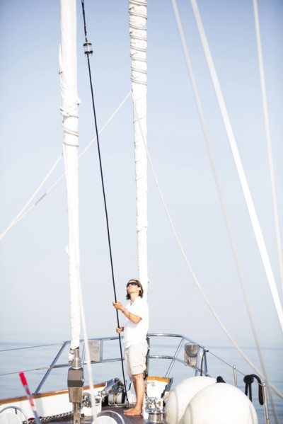 Caucasian woman standing on sailboat deck