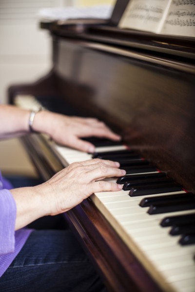 Close up of Caucasian woman musician playing piano