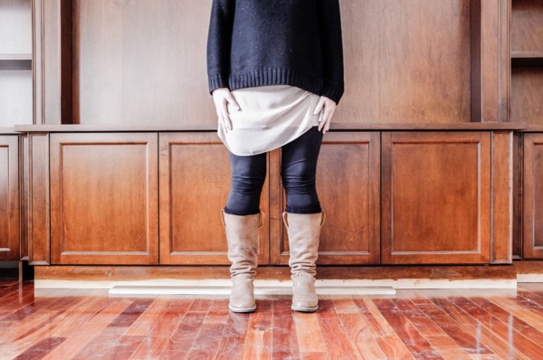Caucasian woman standing in empty room