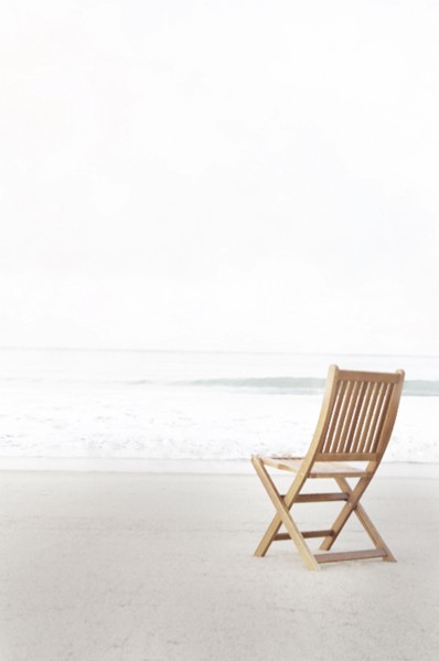Empty folding chair on beach