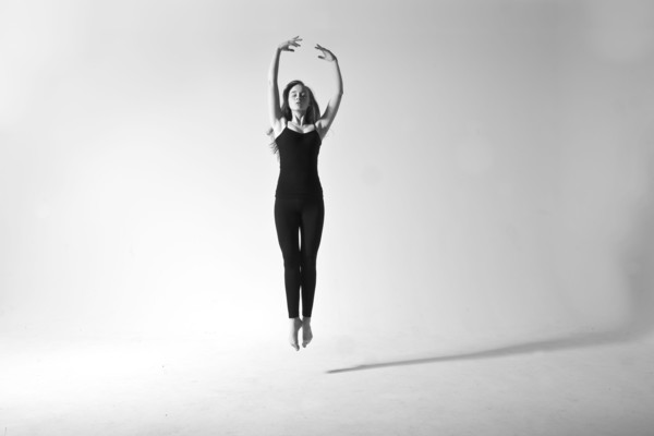 Caucasian dancer jumping for joy