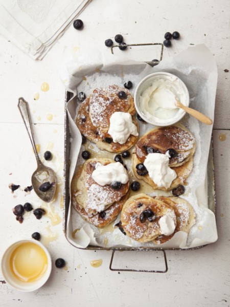 Tray of pancakes with fruit and cream