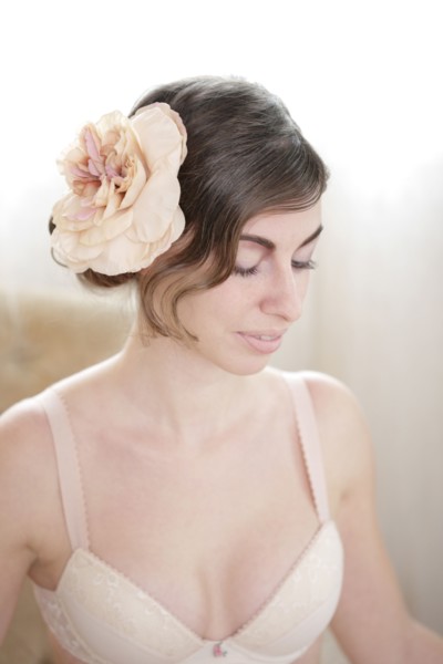 Caucasian woman wearing flower in her hair