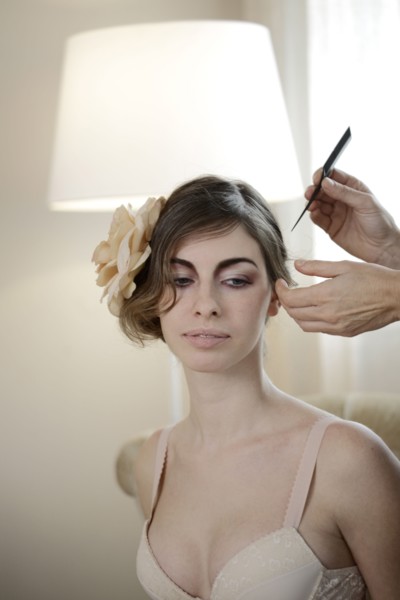Caucasian woman having hair styled