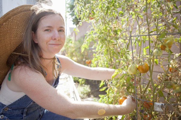 Mixed race farmer working in garden