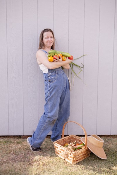 Mixed race farmer with basket of vegetables