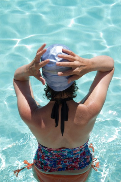 High angle view of Caucasian woman standing in pool