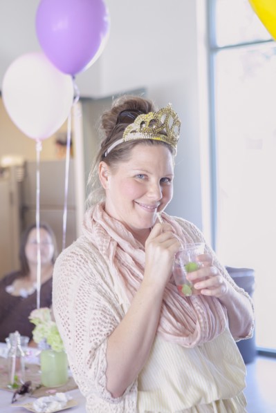 Caucasian woman drinking cocktail at party