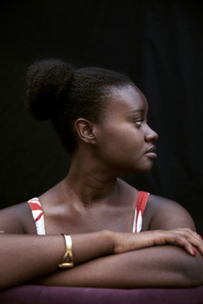 Black woman leaning on forearms