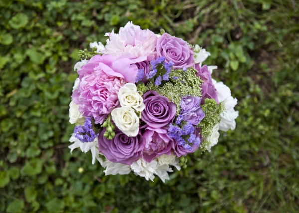 Close up of bouquet of flowers in grass
