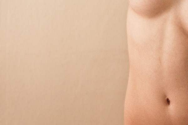 Close up of midsection of nude woman