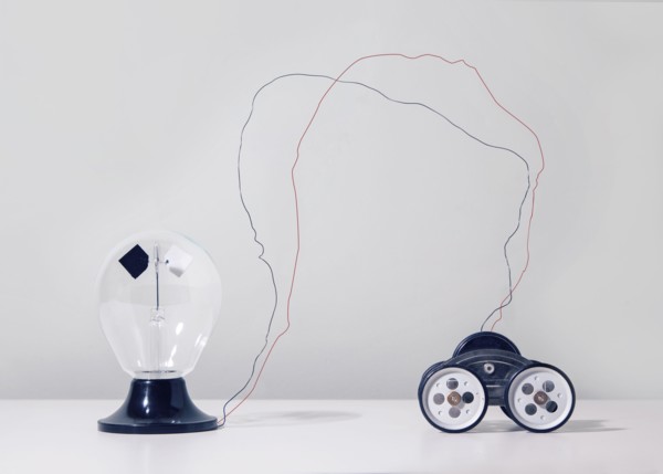 Wire connecting toy car to light bulb