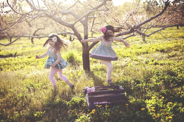 Girls playing in rural field