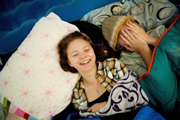 Couple laughing in camping tent