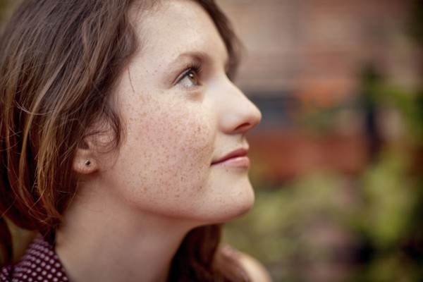 Close up of teenage girl looking up