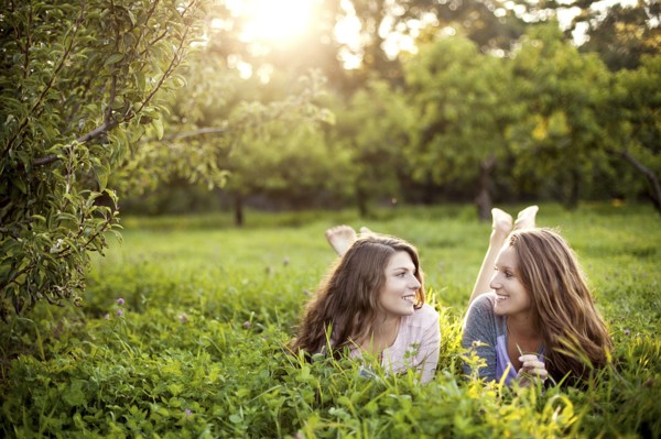 Caucasian women laying in rural field