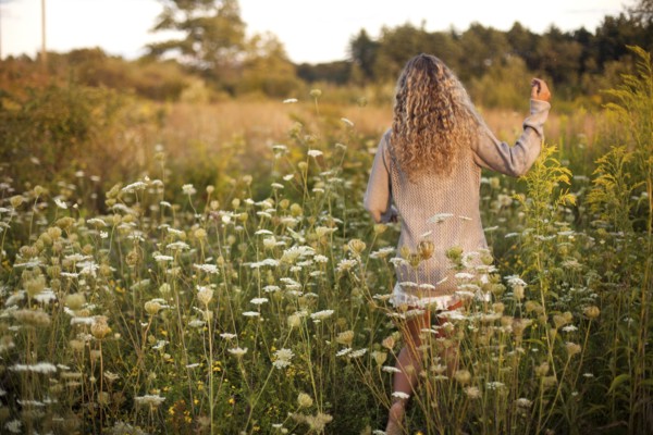 Woman walking in rural field
