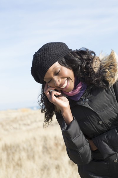 Close up of woman talking on cell phone outdoors