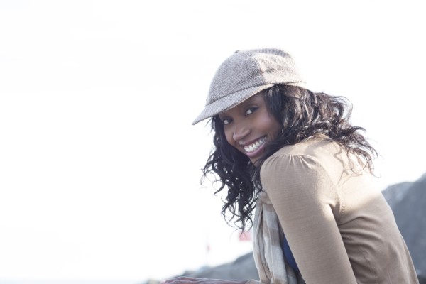 Close up of smiling woman wearing cap outdoors