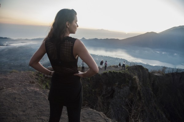 Woman admiring rural landscape from mountaintop